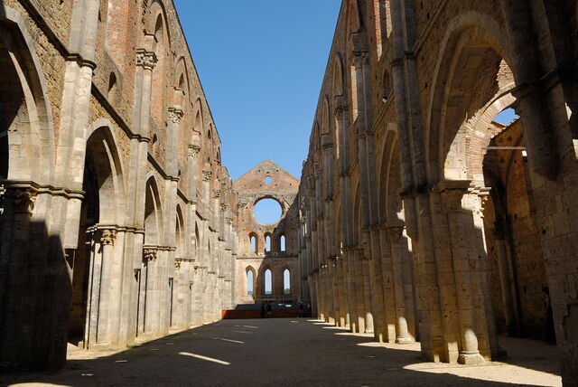 the roofless Abbey of San Galgano under a blue sky