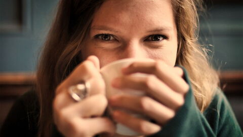 A woman drinking coffee