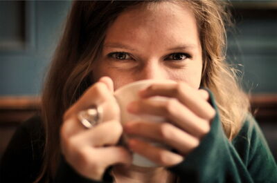 A woman drinking coffee