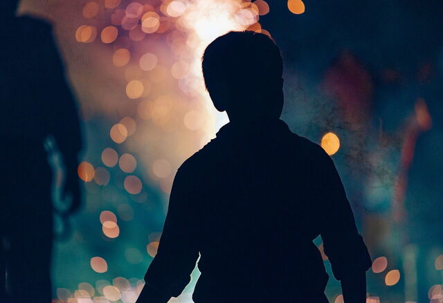 Boy at a bonfire
