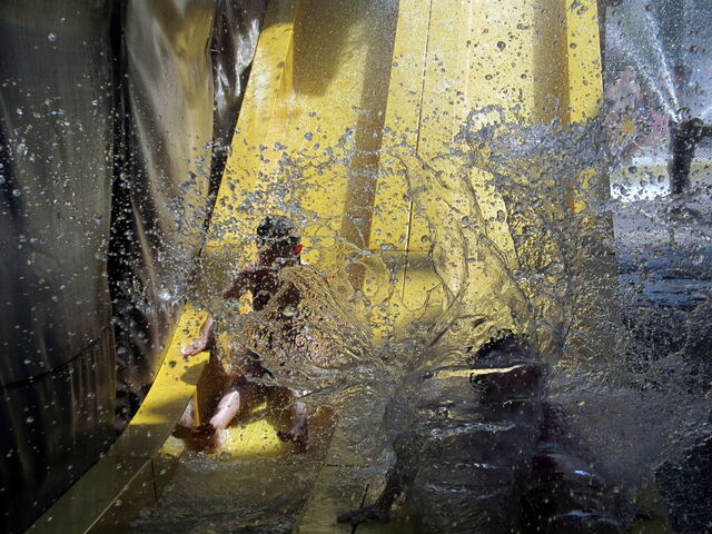 Landing at the bottom of a waterslide