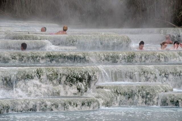 People soaking in the waters of Saturnia