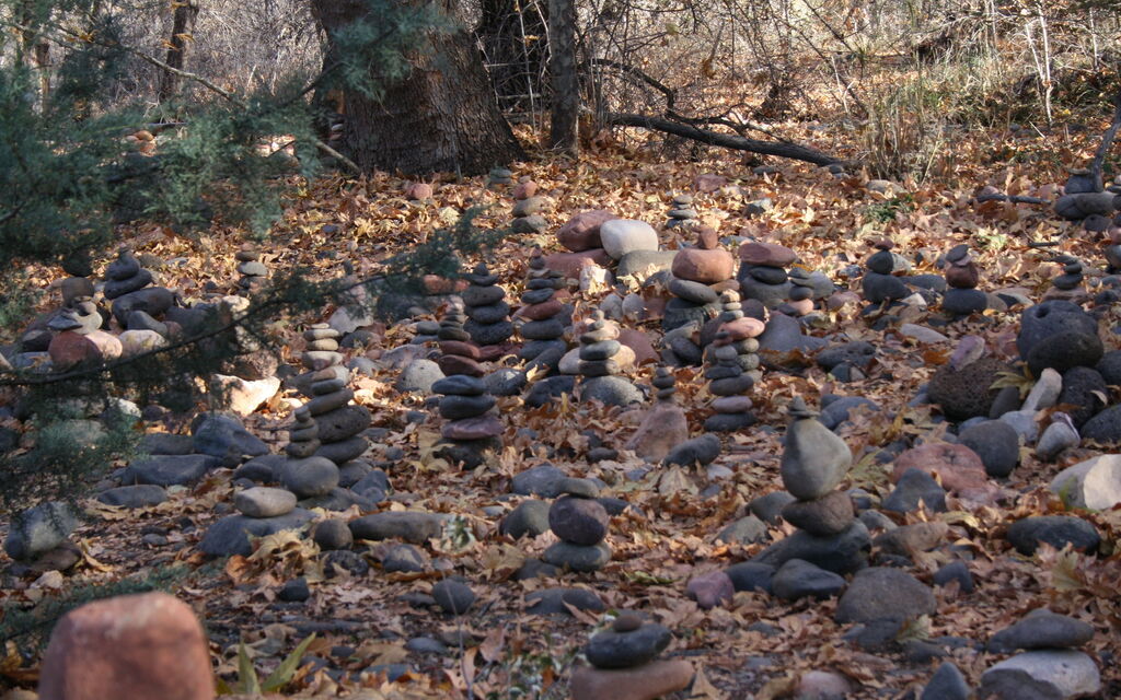 Many stones stacked by many people.