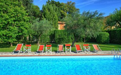 Villa Fiamma: Water, Sky, Plant, Nature, Cloud, Tree, Natural Landscape, Swimming Pool, Leisure, Grass