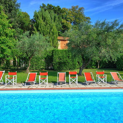 Villa Fiamma: Water, Sky, Plant, Nature, Cloud, Tree, Natural Landscape, Swimming Pool, Leisure, Grass