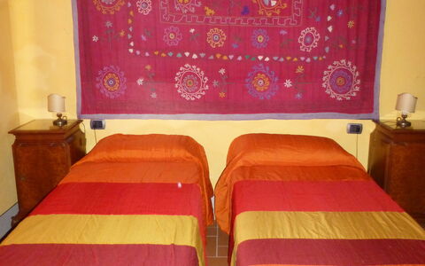 Mulino a Montegonzi Di Rimaggio: Room, Furniture, Property, Bedroom, Bed, Wall, Orange, Interior Design, Textile, Bed Sheet