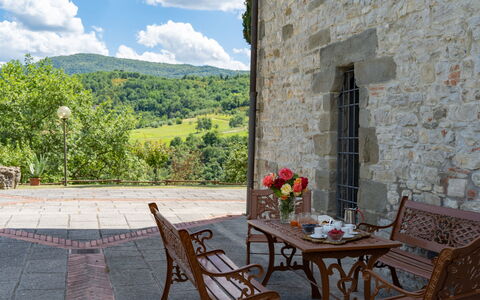 Podere Schignano: Flower, Plant, Table, Furniture, Property, Cloud, Chair, Building, Flowerpot, Sky