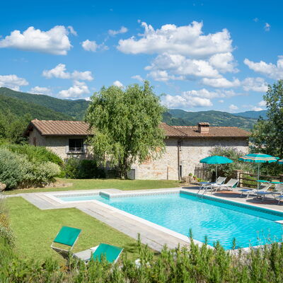 Podere Schignano: Plant, Cloud, Water, Sky, Furniture, Building, Swimming Pool, Green, Tree, Architecture