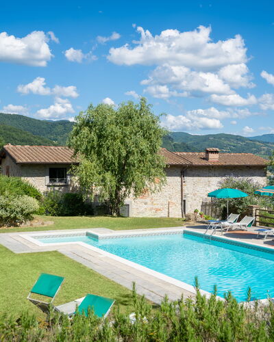 Podere Schignano: Plant, Cloud, Water, Sky, Furniture, Building, Swimming Pool, Green, Tree, Architecture