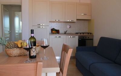 Bilocale Piano Terra 221: Room, Property, Furniture, Interior Design, Building, Living Room, House, Floor, Real Estate, Table