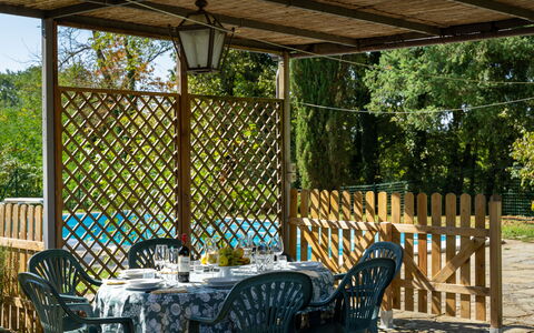 Villa Cinzia: Plant, Property, Furniture, Table, Chair, Light, Shade, Outdoor Table, Outdoor Furniture, Porch