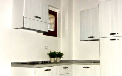 Gaiole Suites 8: White, Room, Furniture, Property, Countertop, Cabinetry, Kitchen, Ceiling, Interior Design, House