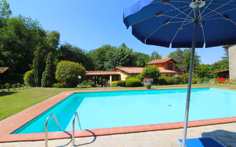 Villa le Balze: Sky, Plant, Property, Building, Umbrella, Blue, Green, Swimming Pool, Shade, Azure