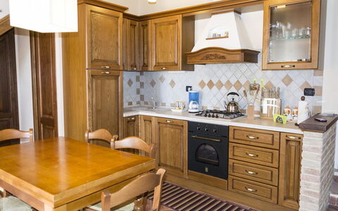 Villa Camelia: Furniture, Countertop, Cabinetry, Room, Kitchen, Property, Interior Design, Building, House, Floor