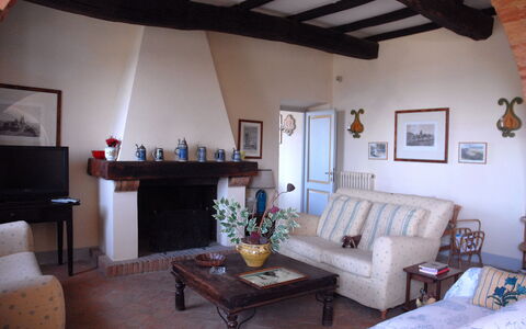 Podere San Giovanni: Furniture, Property, Couch, Table, Picture Frame, Interior Design, Wood, Building, Living Room, Architecture