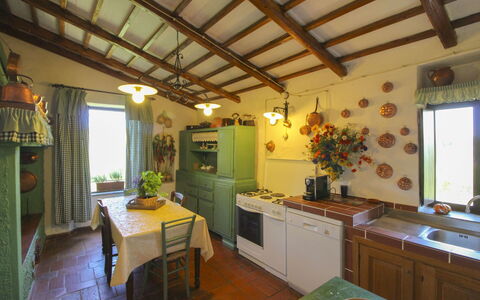 Villa Gioiosa: Furniture, Lighting, Interior Design, Ceiling, Light Fixture, Chair, Kitchen & Dining Room Table, Wood Stain, Houseplant, Kitchen