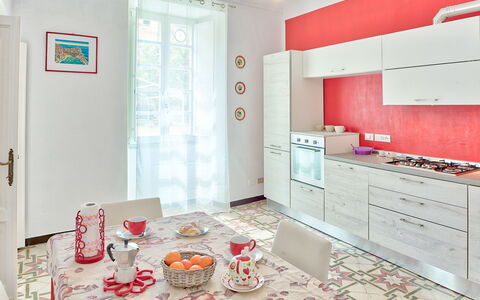 Via Dante Vacanze - Levanto: Room, Property, Interior Design, Furniture, Kitchen, Pink, Cabinetry, Building, Floor, Tile