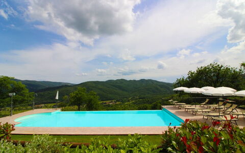 Borgo di Usciano: Cloud, Water, Sky, Plant, Swimming Pool, Building, Blue, Azure, Tree, Natural Landscape