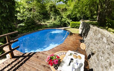 Il Molino: Water, Plant, Property, Swimming Pool, Flower, Tree, Outdoor Furniture, Body Of Water, Shade, Wood