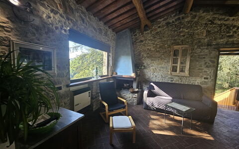 Il Nido: Wall, Furniture, Chair, Cottage, Stone Wall, Living Room, Natural Material, Couch, Coffee Table