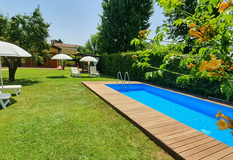 La Capannella: Plant, Shade, Tree, Sky, Swimming Pool, Building, Outdoor Furniture, Water, Real Estate, Flooring
