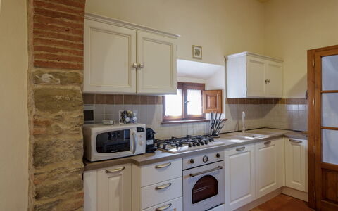 Villa i Cocciai: Room, Property, Kitchen, Cabinetry, Furniture, Countertop, Building, House, Floor, Major Appliance