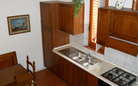 Agriturismo Girasole: Room, Furniture, Property, Cabinetry, Countertop, Wood Stain, Kitchen, House, Building, Hardwood