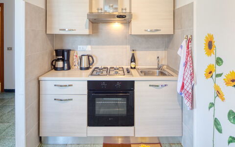 Olivi Del Mesco - Levanto: Room, Property, Kitchen, Cabinetry, Furniture, Kitchen Stove, Yellow, Major Appliance, Countertop, Interior Design