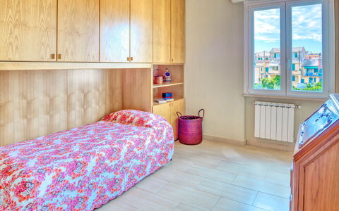 Giulia Apartment 2 - Levanto: Room, Furniture, Bedroom, Property, Bed Sheet, Floor, Interior Design, Bed, Wall, Building