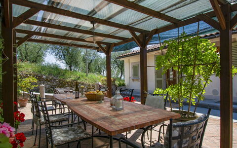 L'Amorosa: Table, Plant, Furniture, Property, Building, Chair, Shade, Outdoor Table, Wood, Outdoor Furniture