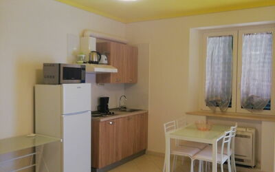 Monolocale 1: Furniture, Room, Property, Interior Design, Yellow, Floor, Building, Ceiling, Wall, House