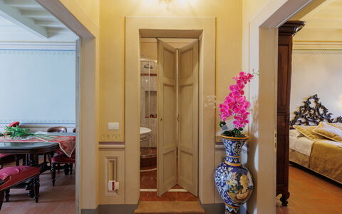 Appartamento Zefferini: Furniture, Building, Door, Interior Design, Table, Decoration, Wood, Flower, Yellow, Floor