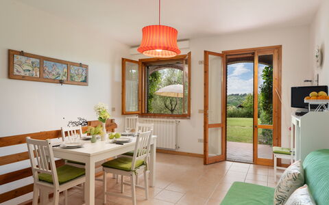 Calanchi Apartments: Furniture, Interior Design, Wood, Table, Flooring, Chair, Room, Home, Dining Room, Lighting