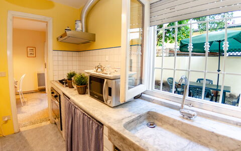 Angelina: Property, Room, Countertop, Building, Interior Design, House, Furniture, Real Estate, Yellow, Kitchen