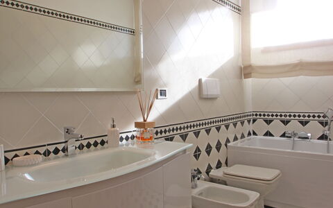 Marina Apartment: Bathroom, Room, Property, Interior Design, Tile, Architecture, Building, Floor, House, Design