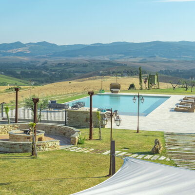 Villa Massimiliano: Sky, Mountain, Water, Cloud, Shade, Land Lot, Grass, Swimming Pool, Natural Landscape, Plant