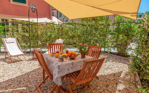 Portovecchio Apartments - Levanto: Property, Real Estate, House, Room, Furniture, Backyard, Building, Table, Home, Patio
