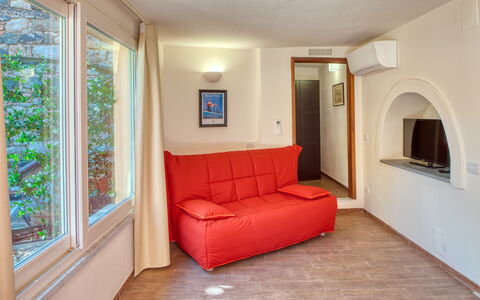 Portovecchio Apartments - Levanto: Interior Design, Furniture, Flooring, Wood, Floor, Room, Ceiling, Couch, Living Room, Apartment