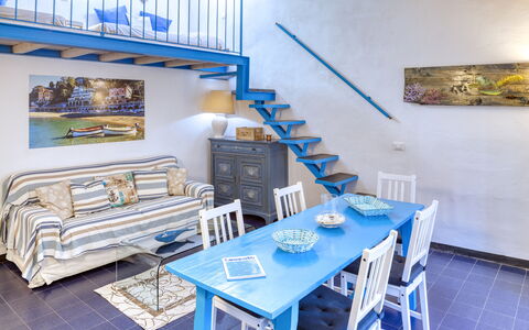 Appartamento Ivana - Levanto: Blue, Wood, Interior Design, Room, Table, Furniture, Stairs, Wall, Floor, Chair