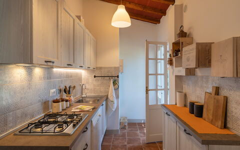 Villa Luana: Property, Cabinetry, Furniture, Countertop, Building, Gas Stove, Wood, Lighting, Interior Design, Kitchen