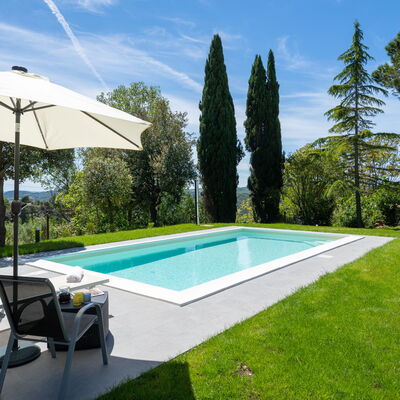 Villa Luana: Cloud, Sky, Plant, Swimming Pool, Water, Shade, Land Lot, Umbrella, Tree, Building
