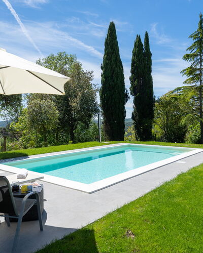 Villa Luana: Cloud, Sky, Plant, Swimming Pool, Water, Shade, Land Lot, Umbrella, Tree, Building