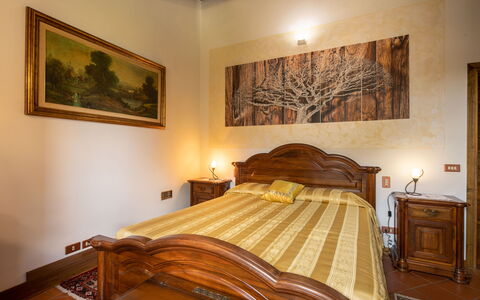 Valdambra Villa: Bed, Furniture, Bedroom, Interior Design, Wall, Bed Sheet, Wood, Bedding, Flooring, Ceiling