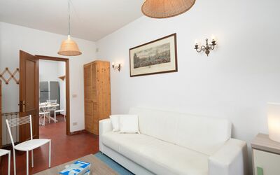 Apuana Suite: Picture Frame, Couch, Property, Furniture, Table, Lighting, Interior Design, Orange, Living Room, Architecture