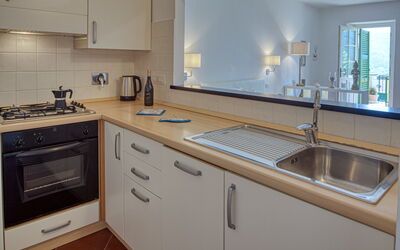 Apartment Cherry: Tap, Countertop, Cabinetry, Kitchen Sink, Sink, Property, Building, Plumbing Fixture, Kitchen, Wood