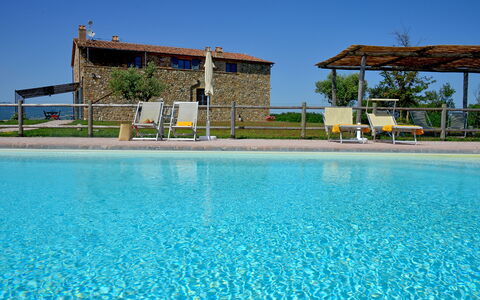 Villa Guardistallo: Water, Sky, Plant, Azure, Swimming Pool, Tree, Building, Leisure, Aqua, Real Estate