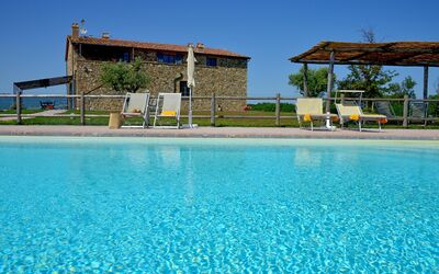 Villa Guardistallo: Water, Sky, Plant, Azure, Swimming Pool, Tree, Building, Leisure, Aqua, Real Estate
