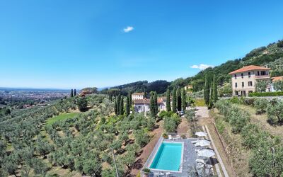 Villa Maona: Sky, Plant, Building, Water, Cloud, Azure, Tree, Vegetation, Urban Design, Residential Area