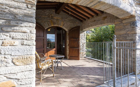 Villa Montignoso: Property, Plant, Wood, Shade, Brickwork, Chair, Brick, Real Estate, Beam, Tree