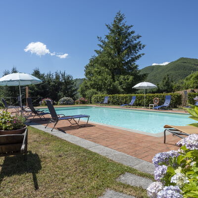 Villa Rosata: Water, Plant, Sky, Furniture, Swimming Pool, Cloud, Umbrella, Nature, Chair, Tree